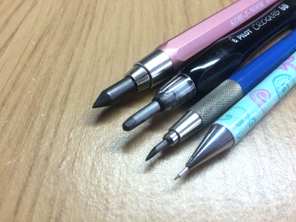 Comparison of pencil leads. From left to right – 5.6mm KOH-I-NOOR HARDTMUTH Clutch Pencil, 3.8mm Pilot Croquis 6b Pencil, 2mm Staedtler Mars Technico Clutch Pencil and 0.5 Mechanical Pencil, by Artist Sophie Lawson